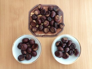 Shiny brown chestnuts on the table
