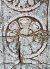Flower Pattern Carvings on Cracked Temple Wall