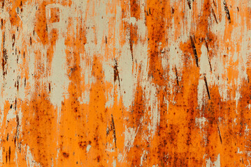 Texture of old rusty metal with scratches and mother-in-law. Abstract grunge metal texture with traces of multi-colored paint