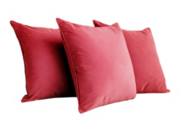 three red velvet throw pillows isolated on transparent background