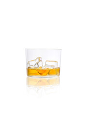 Still life of a glass with whiskey and ice, on a white background