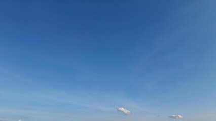 Serenity of Blue Horizons Tranquil Blue with Wispy Clouds