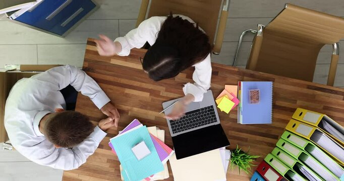 Woman director reprimands man for errors in report. Female criticizes careless approach of employee to task emphasizing importance of following detailed instructions