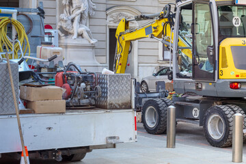 
Repair work on the city street with a forklift and other work equipment