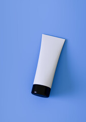 Plastic cosmetic tube for cream or gel mockup on blue background 