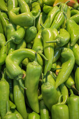 Green chili peppers on a market stall