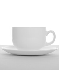Empty tea cup with saucer isolated on white background