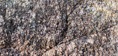 Stone wall texture is old and naturally aged.