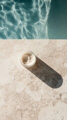 Top view, a cream on the floor next to pool