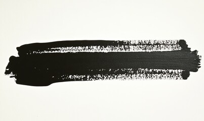 Fototapeta premium Horizontal black paint stroke on white background.