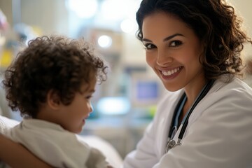 Obraz premium A doctor warmly interacts with a small child in a hospital room. The child has curly hair and looks happy. The doctor wears a white coat and stethoscope, creating a supportive and friendly atmosphere 