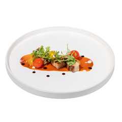 A beautifully plated dish featuring tender meat, vibrant cherry tomatoes, fresh greens, and a drizzle of sauce.