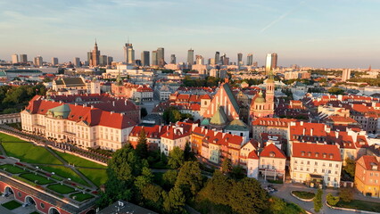 Aerial view of the Warszawa cityscape. Old town and modern skyscrapers at sunrise, Royal Castle. Poland.