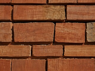 Obraz premium Abstract background of stone building materials in red clay.