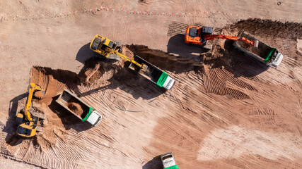 Aerial view road motor grader flatting dirt road surface, Motor grader road construction grader...
