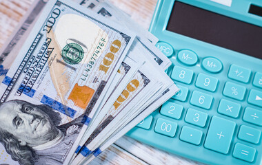 Fototapeta premium Money dollars and calculator, economy concept, money distribution. Euro. The crisis after the covid-19 pandemic. The dollar is falling or rising.