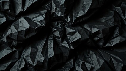 Abstract crumpled black paper texture background.