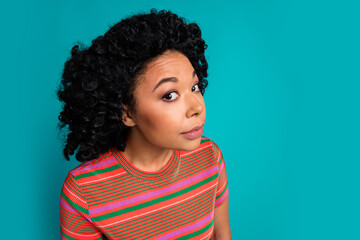 Photo of pretty young girl look eavesdrop empty space wear t-shirt isolated on teal color background