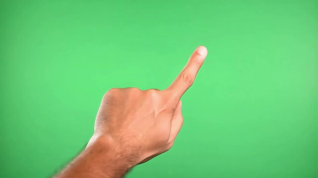 Hand Gesture Indicating Direction Against a Vibrant Green Background: A Creative Expression of Communication