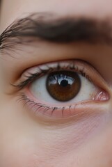 Fototapeta premium Close-up of brown human eyes