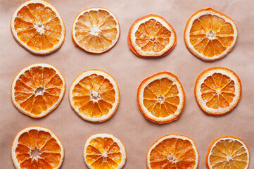 Delicious dried orange on baking sheet and white linen Christmas decoration diy recipe copy space flat lay top view holiday inspiration