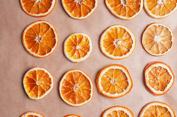 Delicious dried orange on baking sheet and white linen Christmas decoration diy recipe copy space flat lay top view holiday inspiration