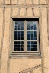 Window of typical half-timber house in Trianon, Versailles, France.