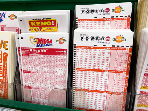 ATLANTA, GEORGIA - NOVEMBER 27, 2024 : Georgia Lottery ticket play slip kiosk. Lotto players choose from a selection of games including Georgia Lotto, Powerball, Mega Millions, Keno, and more.