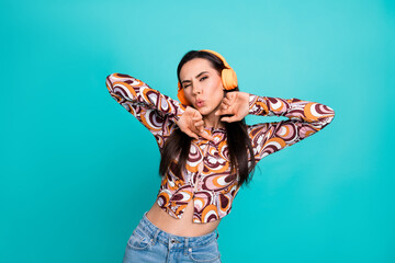 Photo of shiny attractive lady dressed retro shirt singing listening music headphones empty space isolated blue color background