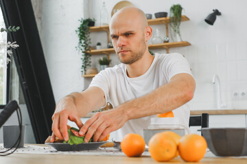 blind man preparing a healthy meal in a modern bright kitchen