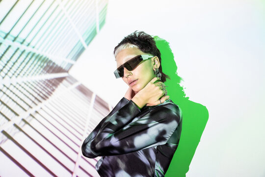 Futuristic woman in metaverse with stylish visor and earrings