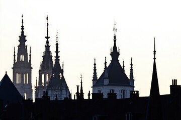 Naklejka premium A large building with a clock tower, suitable for use in backgrounds or architecture scenes