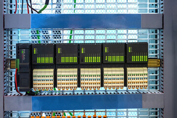 Electrical equipment. Programmable logic controller. Industrial automation equipment. Logic controller for production machines. Control panel with leds and connectors for electrical wires © Grispb