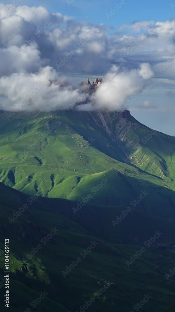 Wall mural beautiful landscape with mountains and clouds in dusk, caucasus, russia, timelapse. vertical video