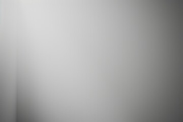 A minimalist gray background with soft lighting, creating a serene atmosphere.