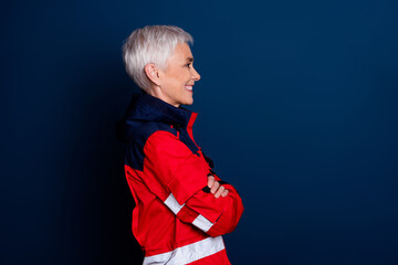Fototapeta premium Photo of nice senior woman crossed hands confident wear uniform paramedic doctor help isolated on dark blue color background