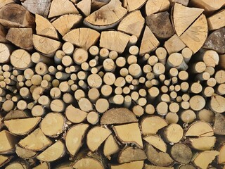 Stacked logs of firewood prepared for using in a fireplace