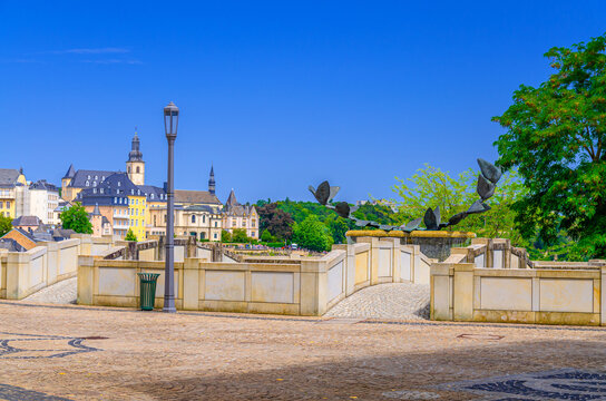 Fontaine aux colombes Fountain with dove of peace sculpture and small bridge in Judiciary Cite judiciaire Justice quarter in Ville Haute quarter with Luxembourg City historical centre background