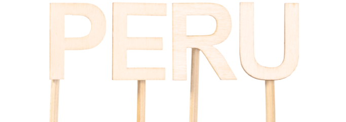 Wood carved letters forming the name Peru on decorative sticks. South American country.