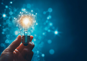 Hand holding illuminated light bulb with network connections symbolizing innovation and technology