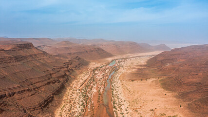 Moroccan Sahara Desert, ancient black volcanic mountains, the Sahara River Oued Ghris, stunning...