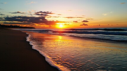 Fototapeta premium Sunset on a peaceful beach, waves gently lapping at the shore, golden and orange hues reflecting on the water