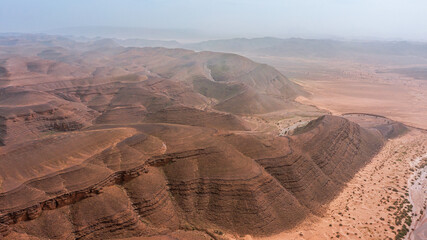Moroccan Sahara Desert, ancient black volcanic mountains, the Sahara River Oued Ghris, stunning...