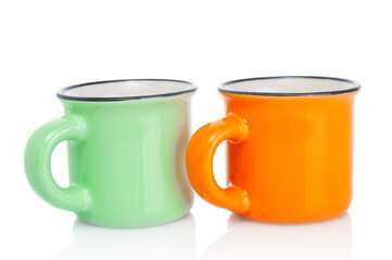 Two empty porcelain  coffee cups close up isolated on white background