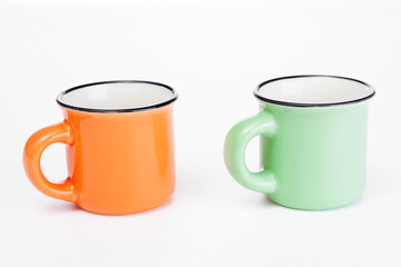 Two empty porcelain  coffee cups close up  on a white background