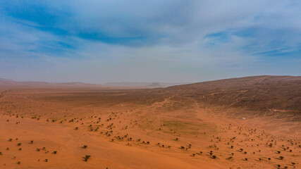 Moroccan Sahara Desert, ancient black volcanic mountains, the Sahara River Oued Ghris, stunning...