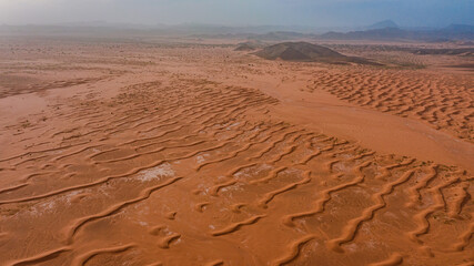 Moroccan Sahara Desert, ancient black volcanic mountains, the Sahara River Oued Ghris, stunning...