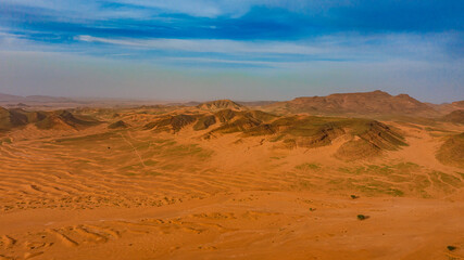 Moroccan Sahara Desert, ancient black volcanic mountains, the Sahara River Oued Ghris, stunning...