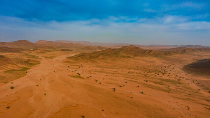 Moroccan Sahara Desert, ancient black volcanic mountains, the Sahara River Oued Ghris, stunning...