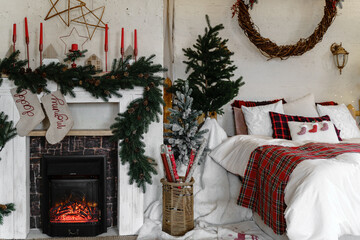 Bedroom interior with fireplace, Christmas trees with spouts for gifts